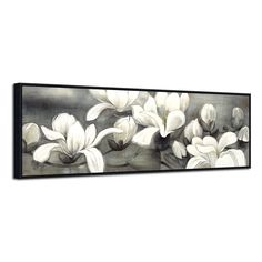 an abstract painting with white flowers on black and white wall art, hanging on the wall