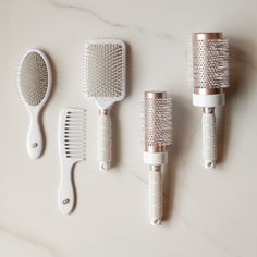 Never underestimate the power of a good hairbrush. The Ultimate Brush Set is a must-have staple for daily styling and touchups. You’ll use them. You’ll love them. You’ll thank us. The Ultimate Brush Set includes: T3 Smooth Paddle Brush, T3 Volume 2.5" Round Brush, T3 Volume 3" Round Brush, and T3 Detangle Duo: Wide tooth comb + Detangle brush. | T3 Pro Brush Collection Classic 5 Hairbrush Collection, White T3 Curling Iron, Detangle Brush, Curling Techniques, Hair Dryer Set, Hair Dryer Accessories, Rotating Curling Iron, Curling Tools, Shower Head Filter, Hair Diffuser