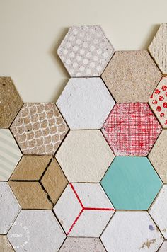 the wall is made up of hexagons with different colors and patterns on them