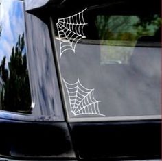 a spider web on the windshield of a car