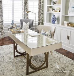 the living room is clean and ready to be used for work or home office space