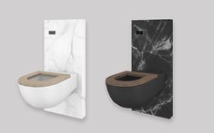 two different types of toilet paper holders and one with a wooden seat on the side