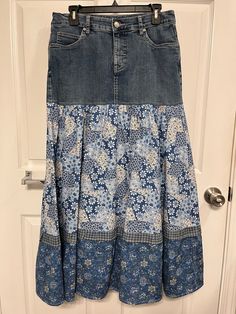 a blue and white skirt hanging on a door