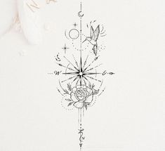 a drawing of a rose and compass on a white paper