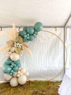 an arch made out of balloons and flowers