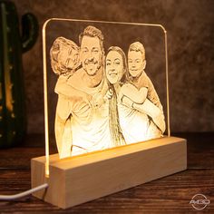 a wooden block with an image of three people on it