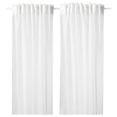 two white curtains hanging on the side of a window