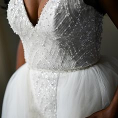 the back of a bride's wedding dress with sequins