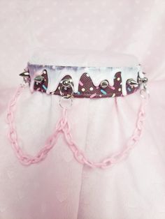 This is a chocolate and vanilla themed cake choker, featuring a chocolate sprinkle pleather base, white drip with teeny silver spikes and pink plastic chain.  Choker measures around ~ 16 inches, please see last photo before ordering and measure yourself carefully! If you need an adjustment to the chain, please message me (or write the measurement in the notes) and I will provide one for free :)  NOTE That this is a printed pleather, please keep all alcohol-based chemicals away from the print or it may degrade/ fade the pleather. Recommended storage is to keep it in the organza bag provided with shipping.  While this choker is ready-made, I do also offer customs at this listing below! Feel free to message me at any time.  https://puffyheart.etsy.com/listing/840254042/custom-choker-do-not-bu Pink Chains, Drippy Cakes, Cute Edgy Outfits, Chunky Choker, Chocolate Sprinkles, Kawaii Accessories, Pink Plastic, Choker Collar, Choker Necklaces