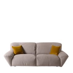 a gray couch with two yellow pillows on the back and one orange pillow on top