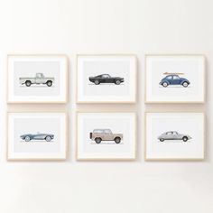 four framed photographs of cars are hanging on the wall in front of a white wall