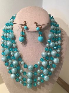 "This is a Mid Century, 4 Strand Turquoise and Green Vintage 1950s Beads and Earrings Set.   These Plastic Beads Sparkle like Glass and are just Beautiful when the light shines on them.  The Necklace measures from 14\" - 19\" with a 4\" Extender.  The Earrings are 1 1/2\" long.  The Fittings are Goldtone.  This Set is in Great Condition and shows very little signs of wear.   As these are a Vintage Set, No Guarantees can be made.  I describe my items as best I can and take my own photos.  If you Mid Century Costume Jewelry, 1950s Beaded Jewelry, Retro Blue Jewelry For Party, Turquoise Faceted Beads Costume Jewelry, Vintage Turquoise Jewelry With Colorful Beads, Retro Colorful Beads Jewelry For Jewelry Making, Retro Beaded Round Jewelry, Retro Colorful Beads Jewelry For Making, Retro Beaded Jewelry With Round Beads