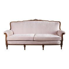 an old fashioned couch with pink velvet upholstered on the back and armrests