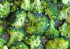 broccoli florets are being cooked in a pan with some seasoning on them