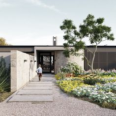 an artist's rendering of the entrance to a house with flowers and plants around it