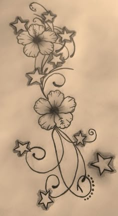 a tattoo design with flowers and stars on it