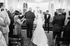 the bride and groom are walking down the aisle