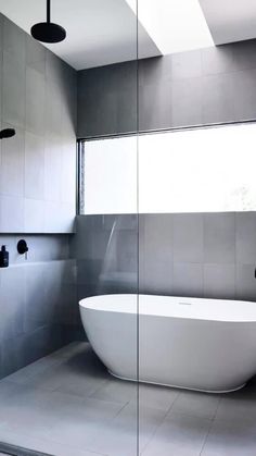 a bathtub and shower in a modern bathroom