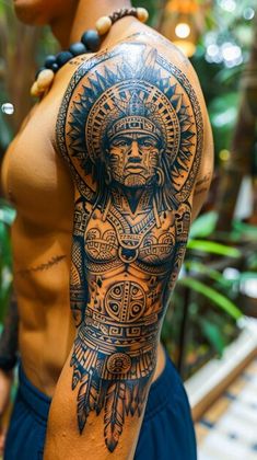 a man with tattoos on his arm and chest