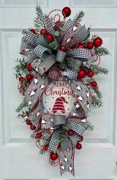 a christmas wreath hanging on the front door