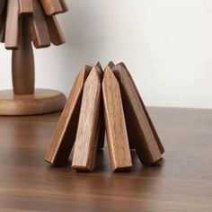 three wooden pieces are stacked on top of each other