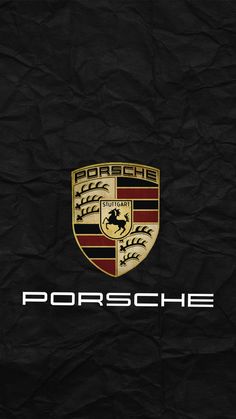 the porsche logo on black paper