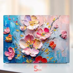 an abstract painting with flowers painted on the back of a blue and pink box,