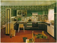 an old kitchen with green and yellow wallpaper