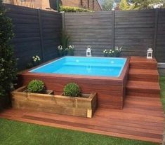 an above ground pool surrounded by wooden steps