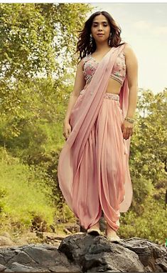 Rose pink dhoti pants and crop top with V neckline with shaded green beads work. Get ready to shine and slay this wedding season in this masterpiece. Dhoti And Crop Top, Dress For Haldi Function, Pink Anarkali Suits, Pastel Bridesmaids, Crop Top Suit, Pastel Pink Dress, Pink Anarkali, Kalki Fashion, Beads Embroidery