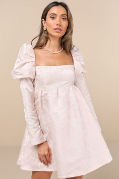 Why dream about looking adorable when the Lulus Lavish Sweetie Blush Jacquard Puff Shoulder Babydoll Mini Dress can make it a reality! Luxe woven jacquard, with a romantic floral design throughout, shapes this dress that has a cutesy babydoll silhouette with a princess-seamed bodice, a square neckline, and long sleeves with dramatic puff shoulders (and hidden no-slip strips). The extra high waist tops a twirl-worthy, skater-style skirt that ends at a flirty mini hem. Slender tying strap secures Puff Shoulder Dress, Knot Tie Dress, Babydoll Mini Dress, Puff Sleeve Dresses, Jacquard Dress, Skater Style, Style Skirt, Tie Dress, Babydoll Dress