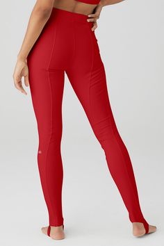 So sleek & powerful. With elevated seam detailing down the center legs, the High-Waist Enso Legging fits just right in smoothing performance Airbrush. The waist-cinching skinny waistband and so-forward toe hook makes this a secure, fitted choice for Pilates and more. Sculpting & smoothing Airbrush Waist-cinching skinny waistband Designed & uniquely fit to flatter every size Wear-tested by our in-house team for the perfect fit Compressive Red Sporty Pants, Red Compressive Sporty Pants, Sporty Compressive Red Pants, Red Compressive Full-length Bottoms, Alo Yoga High Stretch High Waist Bottoms, Red Elastane Athleisure Bottoms, Red Athleisure Bottoms In Elastane, Alo Yoga Stretch Bottoms In Solid Color, Alo Yoga High Stretch Full-length Bottoms