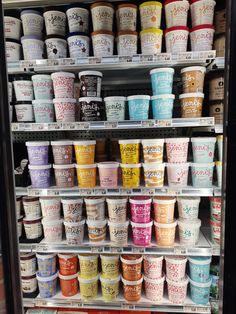 an ice cream display in a store filled with lots of different flavors