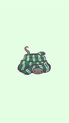 an animal wrapped in a blanket on top of a green background