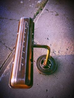 a bench sitting on the side of a road next to a metal object that says man cave ideas why limit happy to one hour?