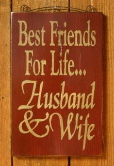 a sign that says best friends for life husband and wife hanging on a wooden wall