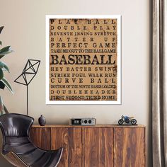 there is a framed baseball game poster on the wall