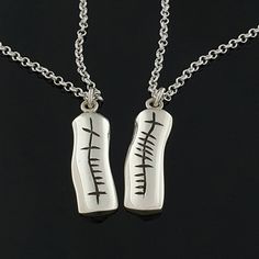 "☘️Description These uniquely styled Anam-Cara (Soul-Mate) pendants come as a set. The two pendants fit seamlessly together just like you and your soulmate. The inscription is darkened to make it stand out against the Silver polished or satin/matt finish and comes complete with a heavyweight belcher/rolo chain. This set of Ogham pendants are a beautiful way to discreetly show your love for your husband, wife, partner or friend. The set is unisex and would also be suitable for teenagers. ☘️What i Unique Bands, Celtic Rings, Irish Jewelry, Soul Mate, Unique Wedding Bands, Rolo Chain, Husband Wife, Pendant Set, Matching Sets