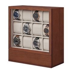 a wooden display case with twelve watches in it