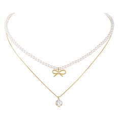 PRICES MAY VARY. This two-layer elegant necklace is made with Imitation pearls, gold-plated bow and cubic zirconia crystal pendant. 1st layer of the necklace are pearls choker with bow pendant, 2nd layer is box chain with 1 carat round- cut cubic zirconia simulated diamond in 4-prong setting. Classical Design: Combination of Bow knot, pearl and cubic zirconia, make this necklace more elegant and charming. Our gold dainty necklaces are plated with 14K gold, nickel free and Lead-free, hypoallergen Necklaces Pearl Bow, Couqette Necklace, Pearls Choker, Dainty Pearl Necklace, Single Pearl Necklace, Pearl Bow, Baroque Pearl Earrings, Bow Necklace, Baroque Pearl Necklace