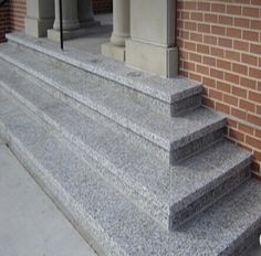 concrete steps leading up to a brick building