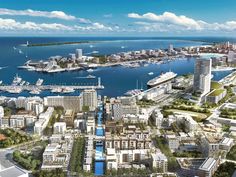 an aerial view of a city with boats in the water