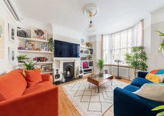 a living room filled with furniture and a fire place