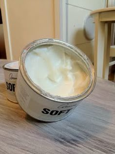 a can of sour cream sitting on top of a wooden table