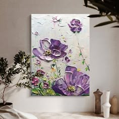 a painting on the wall with purple flowers