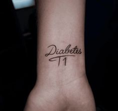 a wrist tattoo with the word diabets on it's left side arm