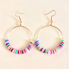 Playful Heishi Beaded Hoop Earrings. These Super Fun, Lightweight Hoops Are Sure To Bring Pizazz To Any Outfit! Bohemian Heishi Beaded Hoop Earrings, Gift Round Heishi Beads Hoop Earrings, Handmade Multicolor Beaded Hoop Earrings, Handmade Multicolor Heishi Beads Hoop Earrings, Playful Multicolor Handmade Hoop Earrings, Stud Fashion, Gold Bead Earrings, Rose Stud Earrings, Tassels Decor