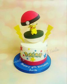 a pokemon themed birthday cake with pikachu on top