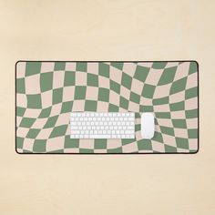 a computer mouse pad with a green and white checkerboard pattern on the surface