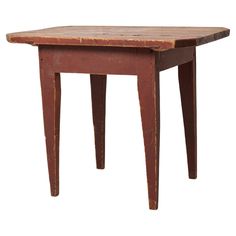 an old wooden table with two legs and a small square top on the bottom, against a white background